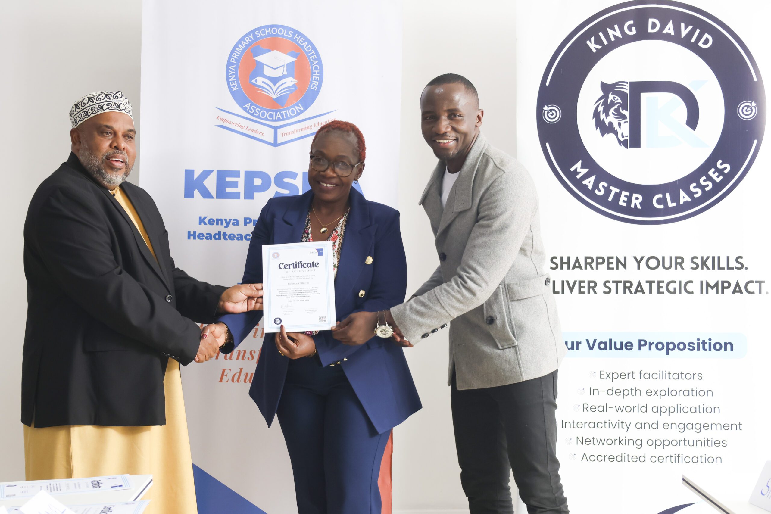 King David handing Leadership certificate to KEPSEA Member